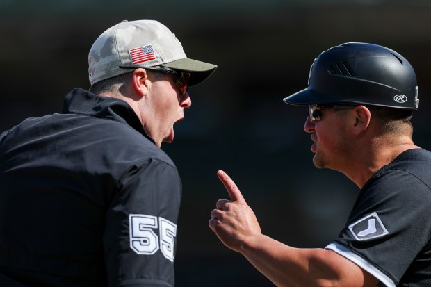 Chicago White Sox third base/infield coach Justin Jirschele (17), right, argues with an umpire in the ninth inning against the Chicago Cubs at Wrigley Field on Sunday, May 18, 2025. (Eileen T. Meslar/Chicago Tribune)