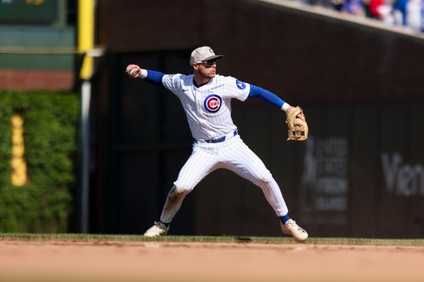 Chicago Cubs second baseman Nico Hoerner (2) throws to first base after fielding the ball in the ninth inning against the Chicago White Sox at Wrigley Field on Sunday, May 18, 2025. (Eileen T. Meslar/Chicago Tribune)