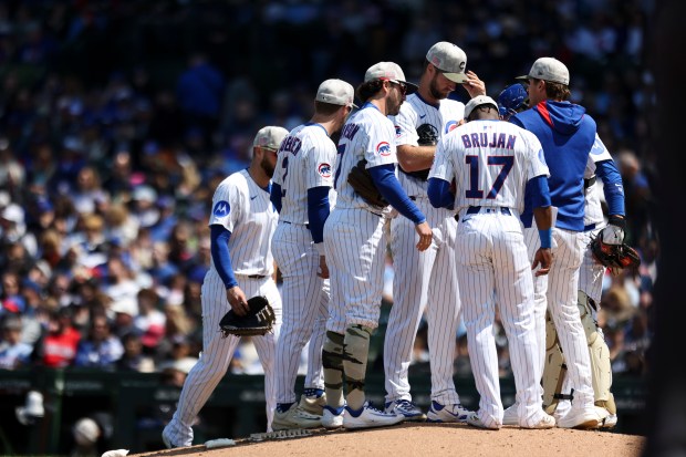 Chicago Cubs pitcher Colin Rea (53) huddles with teammates at the mound in the fifth inning against the Chicago White Sox at Wrigley Field on Sunday, May 18, 2025. (Eileen T. Meslar/Chicago Tribune)