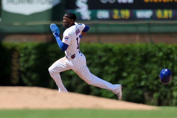 Chicago Cubs third baseman Vidal Bruján (17) runs to third base after outfielder Pete Crow-Armstrong (4) hit a double in the sixth inning against the Chicago White Sox at Wrigley Field on Sunday, May 18, 2025. (Eileen T. Meslar/Chicago Tribune)