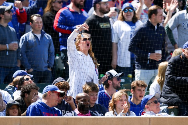 A Chicago Cubs fan boos after the Chicago White Sox challenged third baseman Vidal Bruján (17) being safe at home plate in the sixth inning at Wrigley Field on Sunday, May 18, 2025. (Eileen T. Meslar/Chicago Tribune)