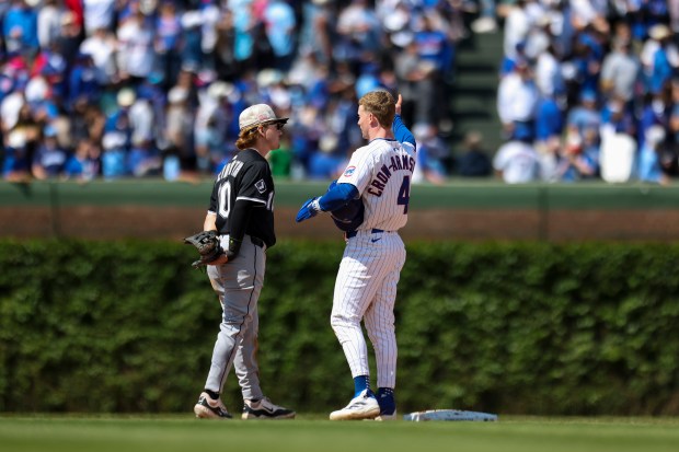 Chicago White Sox shortstop Chase Meidroth (10) speaks to Chicago Cubs outfielder Pete Crow-Armstrong (4) while the White Sox challenge a play at home plate in the sixth inning at Wrigley Field on  Sunday, May 18, 2025. (Eileen T. Meslar/Chicago Tribune)