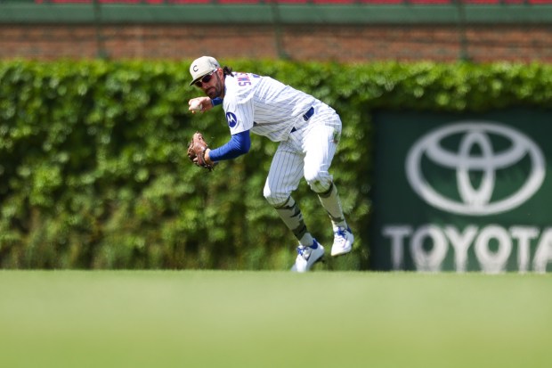 Chicago Cubs shortstop Dansby Swanson (7) throws to first base in the seventh inning against the Chicago White Sox at Wrigley Field on Sunday, May 18, 2025. (Eileen T. Meslar/Chicago Tribune)