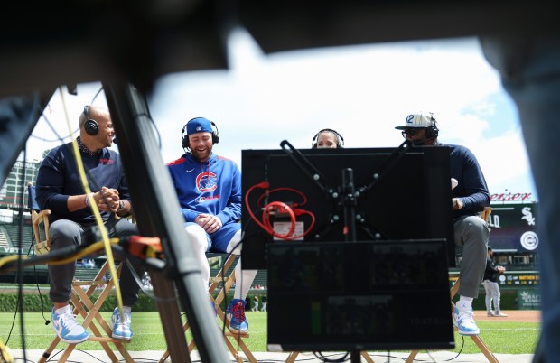 Cubs catcher Carson Kelly, center left, sits for an interview before a game against the White Sox on May 17, 2025, at Wrigley Field. (John J. Kim/Chicago Tribune)