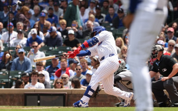 Cubs catcher Miguel Amaya connects for a two-run single against the White Sox in the second inning on May 17, 2025, at Wrigley Field. (John J. Kim/Chicago Tribune)