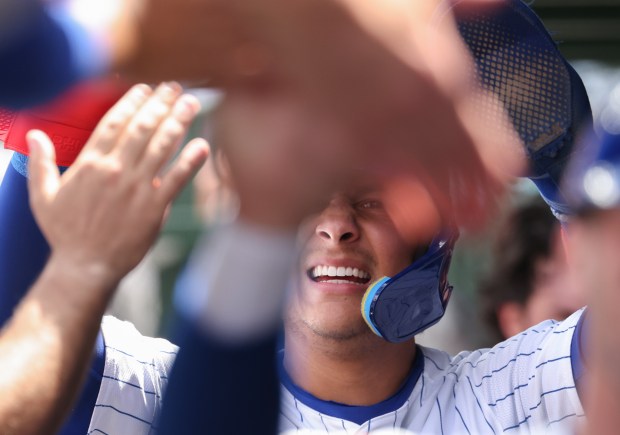 Cubs catcher Miguel Amaya is congratulated after scoring on a two-run single by center fielder Pete Crow-Armstrong in the second inning against the White Sox on May 17, 2025, at Wrigley Field. (John J. Kim/Chicago Tribune)