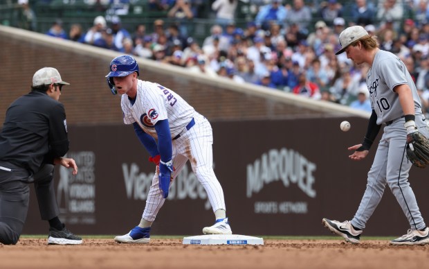 Cubs center fielder Pete Crow-Armstrong keeps his foot on the bag while stealing second base as White Sox shortstop Chase Meidroth handles the throw in the second inning on May 17, 2025, at Wrigley Field. (John J. Kim/Chicago Tribune)