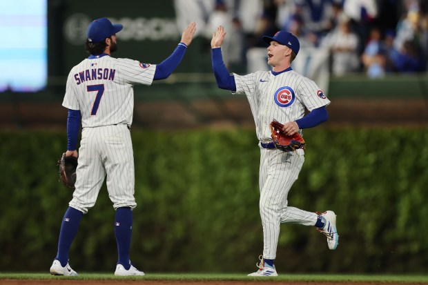 The Cubs' Dansby Swanson and Pete Crow-Armstrong celebrate after defeating the Marlins on Monday, May 12, 2025, at Wrigley Field. (Michael Reaves/Getty Images)