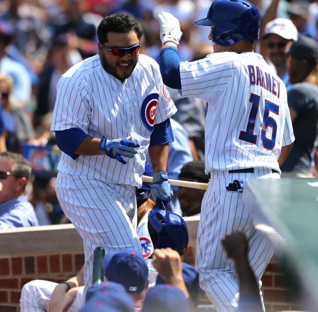 Darwin Barney greets Chicago Cubs catcher Dioner Navarro after Navarro hit his second home run of the game during the Crosstown Classic against the Chicago White Sox on May 29, 2013 at Wrigley Field. (Phil Velasquez/Chicago Tribune)