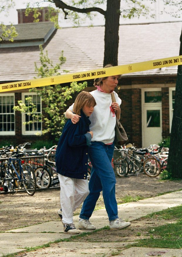 Parents take their children home after Laurie Dann shot several second-graders, killing Nicky Corwin, 8, at Hubbard Woods Elementary School in Winnetka on May 20, 1988. (Chuck Berman/Chicago Tribune)