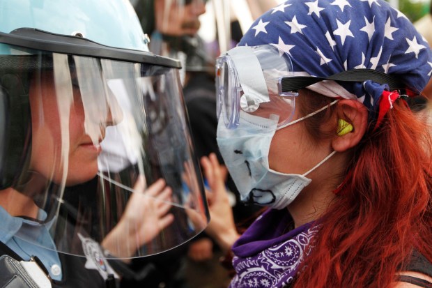 At Cermak Road and Wabash Avenue, NATO protesters clash with Chicago police as police slowly move the crowd west in small groups on May 20, 2012. (Chris Walker/Chicago Tribune)