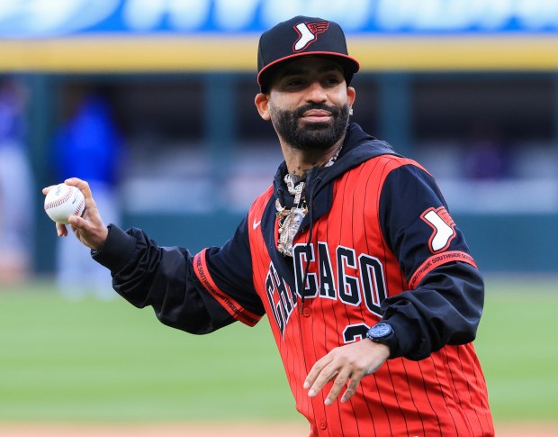 Reggaeton artist Arcángel throws out a ceremonial first pitch before a White Sox-Rangers game at Rate Field on May 23, 2025, in Chicago. (John J. Kim/Chicago Tribune)