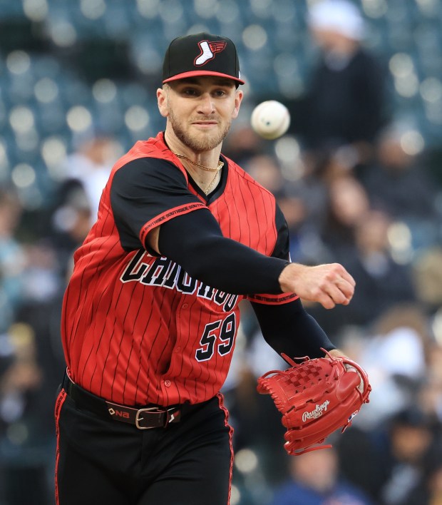 White Sox starting pitcher Sean Burke throws to first in the first inning against the Rangers at Rate Field on May 23, 2025, in Chicago. (John J. Kim/Chicago Tribune)