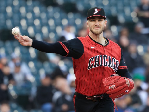 White Sox starting pitcher Sean Burke throws to first in the first inning against the Rangers at Rate Field on May 23, 2025, in Chicago. (John J. Kim/Chicago Tribune)