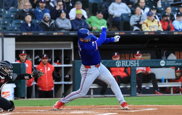 Rangers first baseman Jake Burger loses his bat during an at-bat against the White Sox in the first inning at Rate Field on May 23, 2025, in Chicago. (John J. Kim/Chicago Tribune)