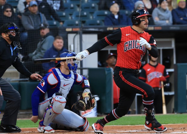White Sox right fielder Mike Tauchman swings through for a single against the Rangers in the first inning at Rate Field on May 23, 2025, in Chicago. (John J. Kim/Chicago Tribune)