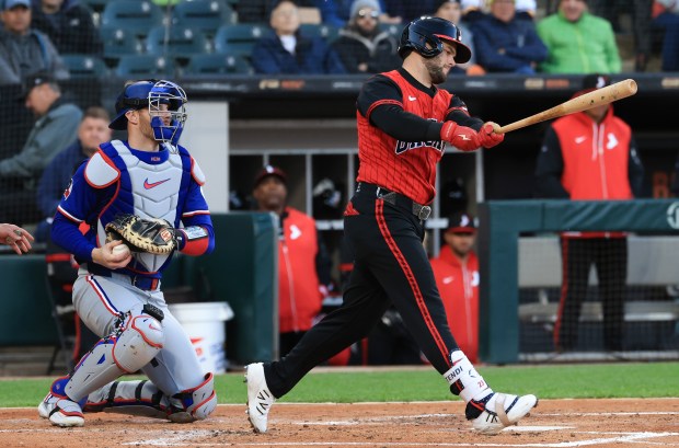 White Sox designated hitter Andrew Benintendi swings for a strike in the second inning against the Rangers at Rate Field on May 23, 2025, in Chicago. (John J. Kim/Chicago Tribune)