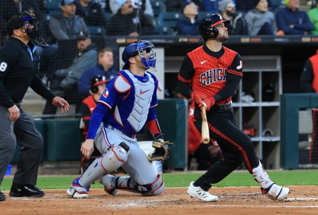 White Sox designated hitter Andrew Benintendi watches the ball head to center field for an RBI sac fly in the third inning against the Rangers at Rate Field on May 23, 2025, in Chicago. (John J. Kim/Chicago Tribune)