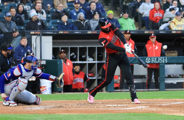 White Sox center fielder Luis Robert Jr. connects for an RBI single in the third inning against the Rangers at Rate Field on May 23, 2025, in Chicago. (John J. Kim/Chicago Tribune)