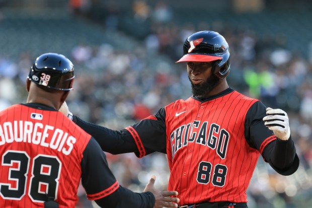 White Sox center fielder Luis Robert Jr. smiles after hitting an RBI single in the third inning against the Rangers at Rate Field on May 23, 2025, in Chicago. (John J. Kim/Chicago Tribune)