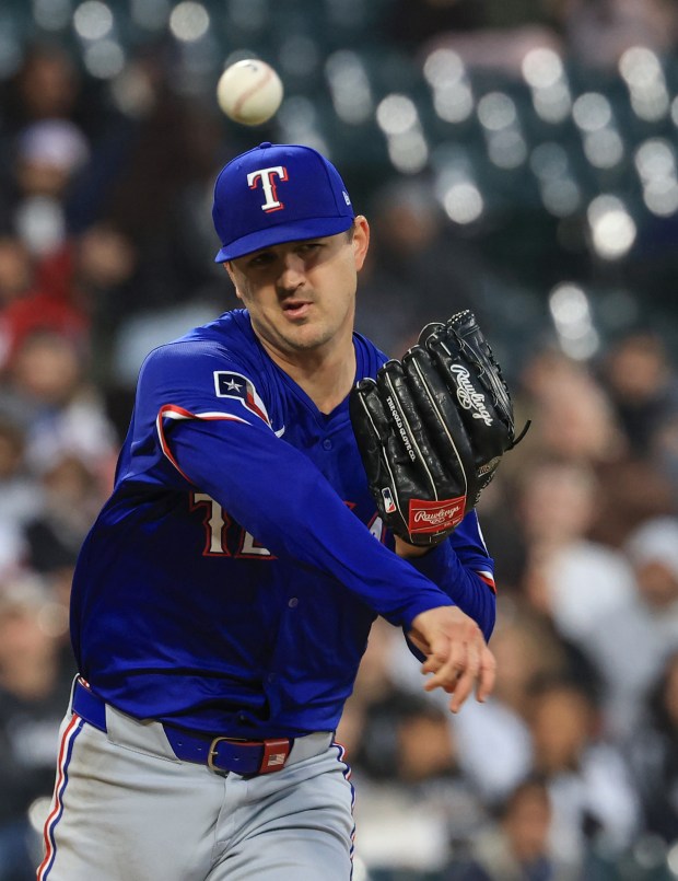 Rangers starting pitcher Tyler Mahle throws to first in the fifth inning against the White Sox at Rate Field on May 23, 2025, in Chicago. (John J. Kim/Chicago Tribune)