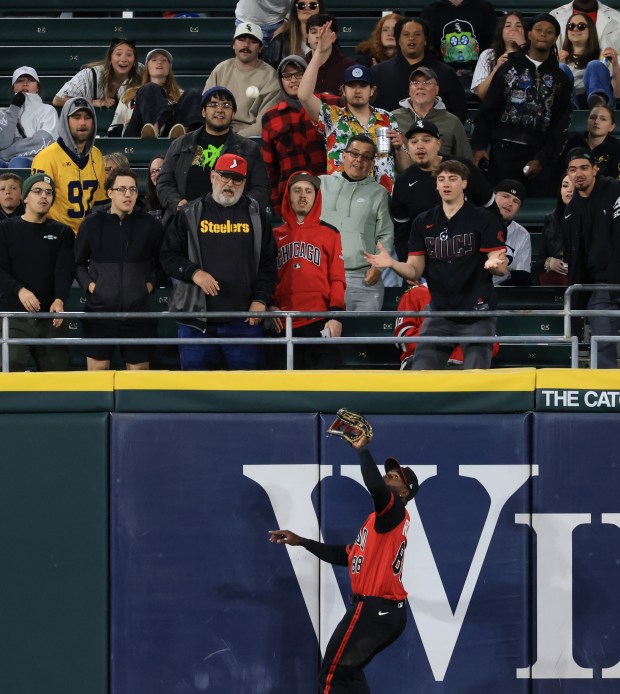 White Sox center fielder Luis Robert Jr. catches a fly ball from Rangers second baseman Marcus Semien at the wall in the eighth inning at Rate Field on May 23, 2025, in Chicago. (John J. Kim/Chicago Tribune)