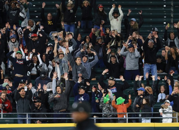 Fans do the wave in the eighth inning of a White Sox-Rangers game at Rate Field on May 23, 2025, in Chicago. (John J. Kim/Chicago Tribune)