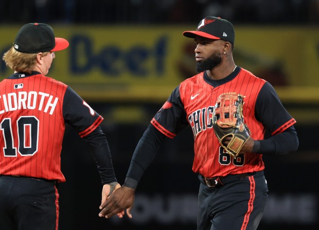 White Sox shortstop Chase Meidroth, left, and center fielder Luis Robert Jr. celebrate a 4-1 win over the Rangers on May 23, 2025, at Rate Field. (John J. Kim/Chicago Tribune)