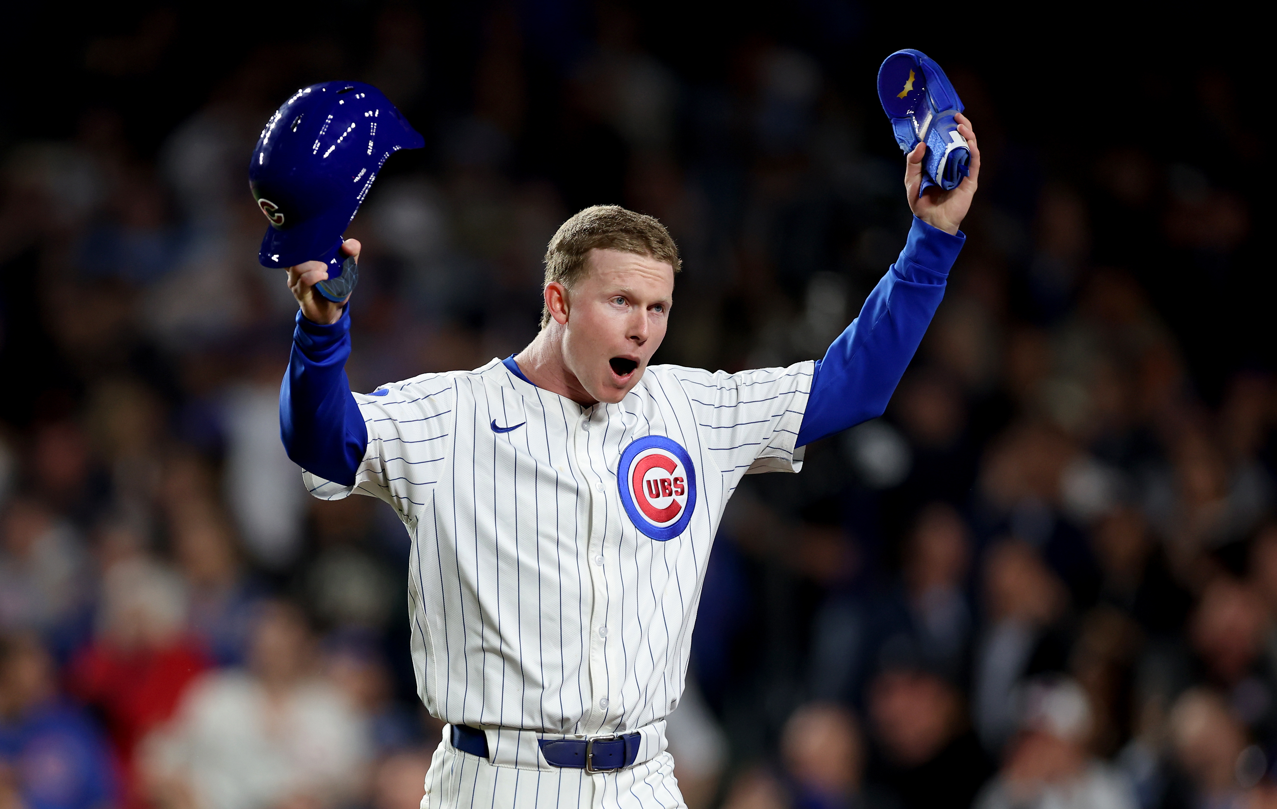 Chicago Cubs outfielder Pete Crow-Armstrong tries to pump up the crowd after scoring on a single by teammate Justin Turner in the ninth inning of a game against the San Francisco Giants at Wrigley Field in Chicago on May 6, 2025. (Chris Sweda/Chicago Tribune)