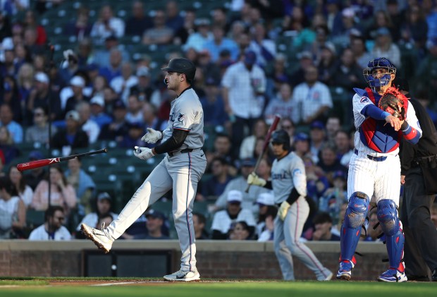 Marlins first baseman Matt Mervis strikes out beside Cubs catcher Miguel Amaya in the second inning on May 14, 2025, at Wrigley Field. (Chris Sweda/Chicago Tribune)