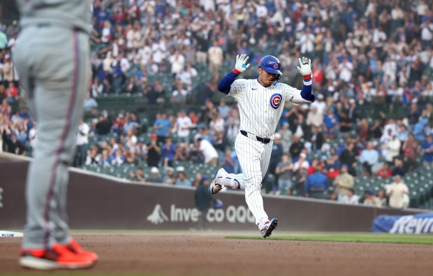 Cubs left fielder Seiya Suzuki celebrates as he rounds the bases after hitting a solo home run in the fourth inning against the Marlins on May 14, 2025, at Wrigley Field. (Chris Sweda/Chicago Tribune)