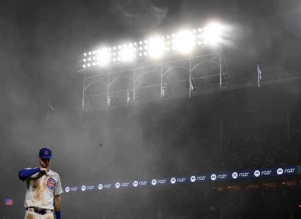 With intense fog moving through the area, Chicago Cubs right fielder Kyle Tucker walks to the dugout after the top of the eighth inning against the Miami Marlins at Wrigley Field in Chicago on May 14, 2025. (Chris Sweda/Chicago Tribune)