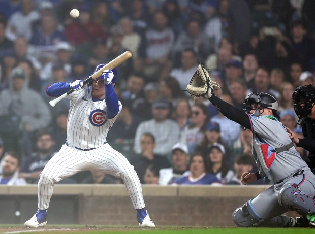 Chicago Cubs center fielder Pete Crow-Armstrong (4) bunts the ball for a single in the sixth inning of a game against the Miami Marlins at Wrigley Field in Chicago on May 14, 2025. (Chris Sweda/Chicago Tribune)