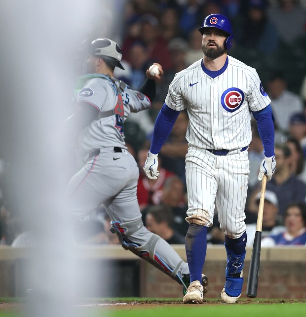 Chicago Cubs third baseman Jon Berti (5) walks back to the dugout after striking out to end the seventh inning of a game against the Miami Marlins at Wrigley Field in Chicago on May 14, 2025. (Chris Sweda/Chicago Tribune)