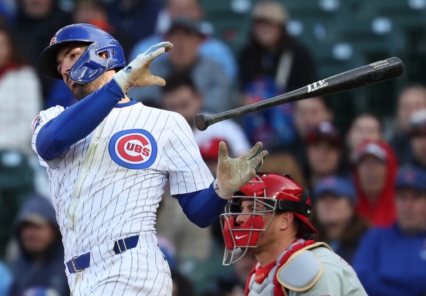 Cubs shortstop Dansby Swanson lets go of his bat as he strikes out against the Phillies on April 26, 2025, at Wrigley Field. (Chris Sweda/Chicago Tribune)