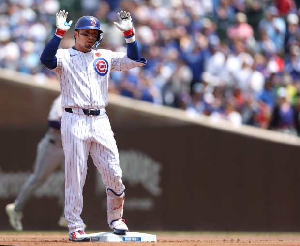 Chicago Cubs designated hitter Seiya Suzuki stands at second base after hitting a double in the first inning of a game against the Colorado Rockies at Wrigley Field in Chicago on May 26, 2025. (Chris Sweda/Chicago Tribune)