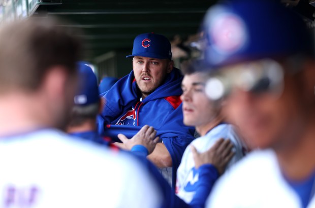 Chicago Cubs starting pitcher Jameson Taillon puts a sweatshirt on in the dugout after the fifth inning of a game against the Colorado Rockies at Wrigley Field in Chicago on May 26, 2025. (Chris Sweda/Chicago Tribune)