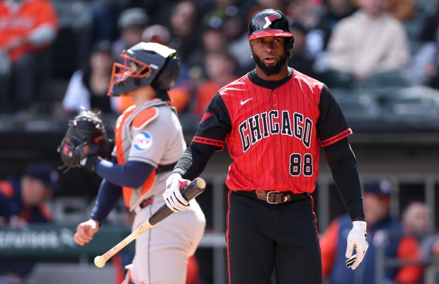 White Sox designated hitter Luis Robert Jr. walks to the dugout after striking out in the eighth inning against the Astros on May 3, 2025, at Rate Field. (Chris Sweda/Chicago Tribune)