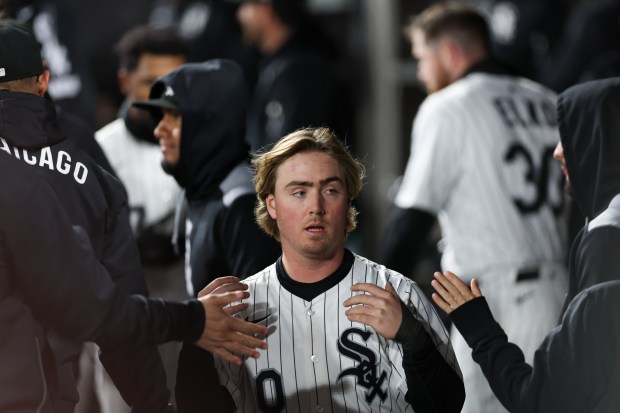 Chicago White Sox shortstop Chase Meidroth (10) celebrates in the dugout after scoring on a RBI single from Chicago White Sox first base Andrew Vaughn (25) during the ninth inning against the Seattle Mariners at Rate Field on Monday, May 19, 2025, in Chicago. (Armando L. Sanchez/Chicago Tribune)
