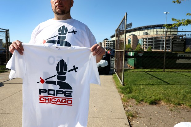 A vendor sells a pope-related White Sox T-shirts outside Rate Field before a game against the Marlins on May 10, 2025. (Chris Sweda/Chicago Tribune)