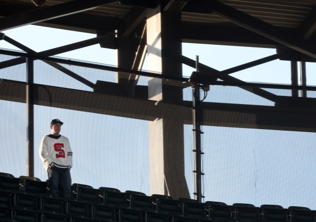A fan in a White Sox sweater watches from the upper deck in the third inning of a game against the Marlins on May 10, 2025, at Rate Field. (Chris Sweda/Chicago Tribune)
