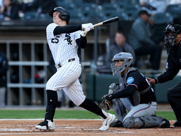Chicago White Sox designated hitter Andrew Vaughn hits a solo home run in the first inning of a game against the Miami Marlins at Rate Field in Chicago on May 10, 2025. (Chris Sweda/Chicago Tribune)