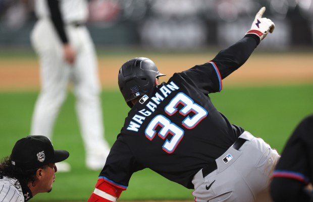 Marlins first baseman Eric Wagaman (33) celebrates after hitting a two-run triple in the eighth inning against the White Sox on May 10, 2025, at Rate Field. (Chris Sweda/Chicago Tribune)