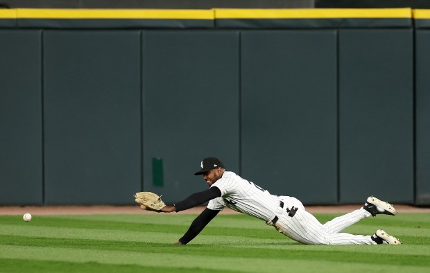 White Sox center fielder Michael A. Taylor is unable to make a play on a ball that went for a two-run triple for Marlins first baseman Eric Wagaman in the eighth inning on May 10, 2025, at Rate Field. (Chris Sweda/Chicago Tribune)
