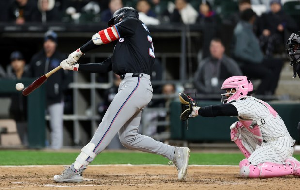 Marlins first baseman Eric Wagaman hits a two-run triple in the eighth inning against the White Sox on May 10, 2025, at Rate Field. (Chris Sweda/Chicago Tribune)