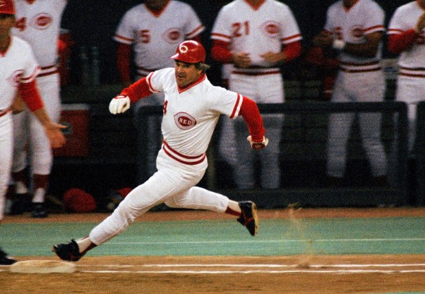 FILE - In this Sept. 11, 1985, file photo, Cincinnati Reds' Pete Rose rounds first base after hitting a single to break Ty Cobbs' hitting record during a baseball game at Riverfront Stadium in Cincinnati. . ESPN says it obtained a notebook that shows Rose bet on Reds games during his last season as an active player in 1986. The career hits leader agreed to a lifetime ban from baseball in 1989 after an investigation by John Dowd, a lawyer retained by Major League Baseball, concluded he bet on the Reds to win from 1985-87, during his time as a player and manager. (AP Photo/File)