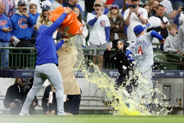 Center fielder Pete Crow-Armstrong tries to elude a Gatorade shower after the Cubs' 6-2 win over the Brewers on May 3, 2025, in Milwaukee. (John Fisher/Getty Images)
