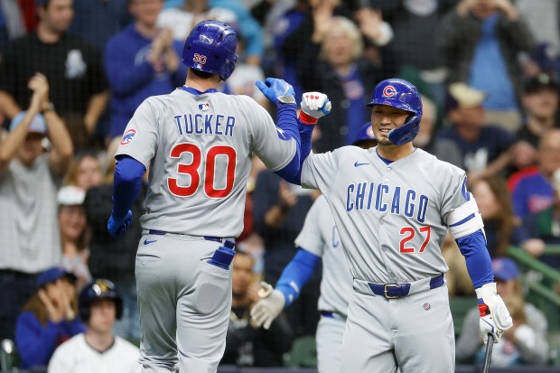 The Cubs' Seiya Suzuki, right, congratulates Kyle Tucker after Tucker hit a solo home run in the fifth inning against the Brewers on May 3, 2025, in Milwaukee. (John Fisher/Getty Images)