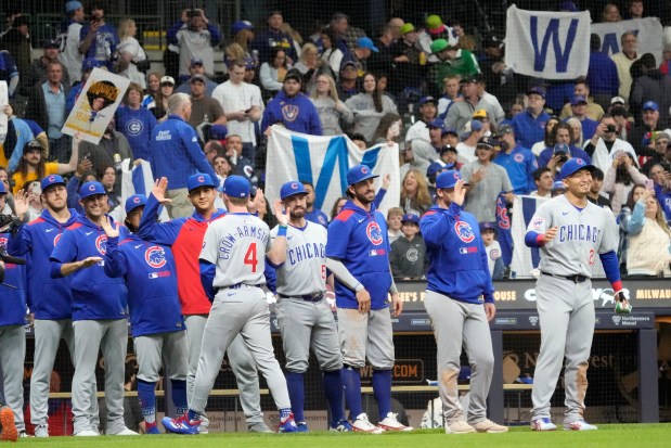 Chicago Cubs' Pete Crow-Armstrong (4) high-fives teammates after they won a baseball game against the Milwaukee Brewers, Friday, May 2, 2025, in Milwaukee. (AP Photo/Kayla Wolf)