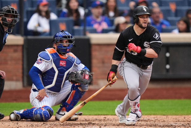 White Sox left fielder Andrew Benintendi watches his RBI triple in front of Mets catcher Luis Torrens during the sixth inning on May 28, 2025, in New York. (Frank Franklin II/AP)